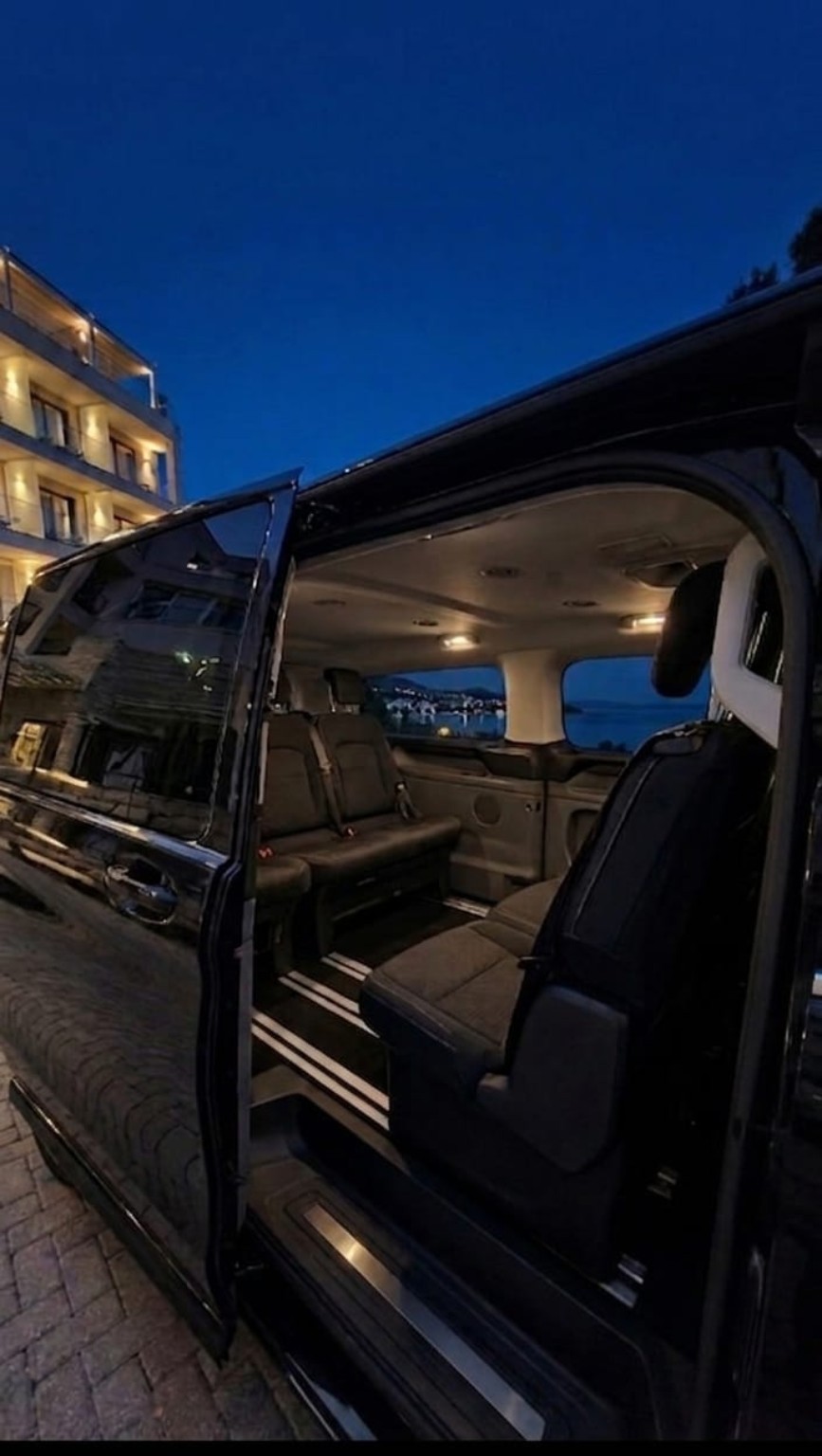 Limo4me vehicle with the sliding door open, showing the premium interior